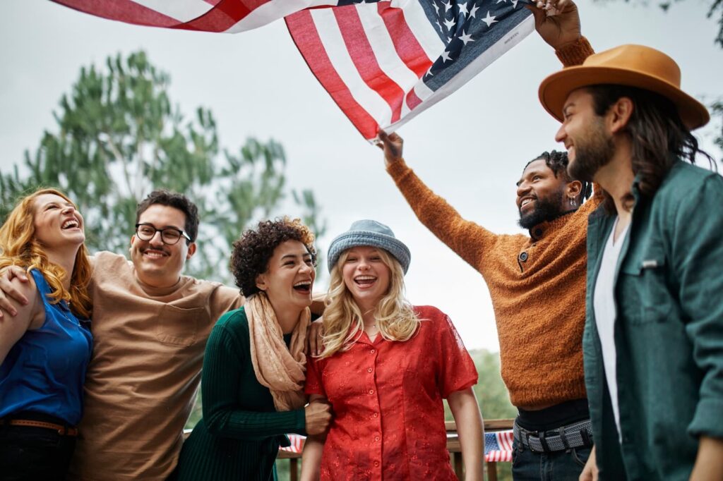 Smiling people holding a flag